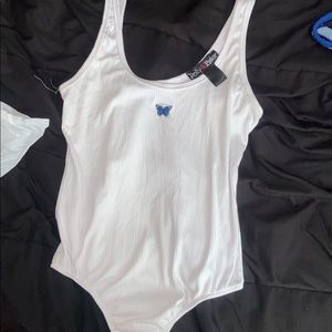 white butterfly bodysuit, never worn, doesn’t snap at bottom